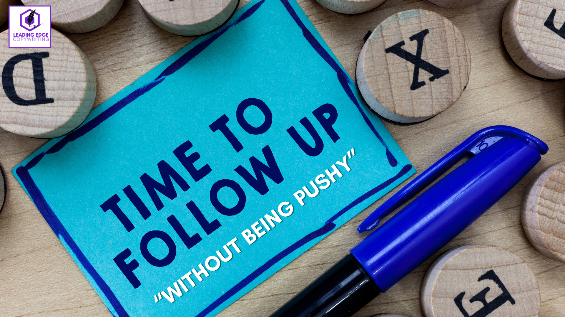 A graphic displays a blue sticky note with the words 'Time to follow up without being pushy' written on it. Next to the sticky note, there are wooden circles with letters on them, and a pen is placed beside them.